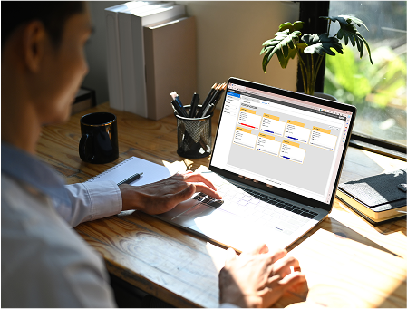 Samsung S-Hub ultrasound system management showing healthcare professional using laptop interface for centralized comprehensive ultrasound system management, enhancing workflow for sonographers, biomed service engineers, and hospital administrators with safeguarded compliance to security regulations